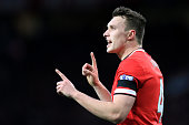 Phil Jones gestures whilst in action for Manchester United