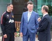 Manchester United manager Louis Van Gaal in conversation with his assistant Ryan Giggs and chairman Ed Woodward