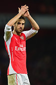 Mathieu Flamini applauds the Arsenal supporters