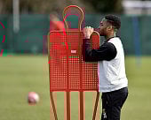 Raheem Sterling looks on during a training session with Liverpool