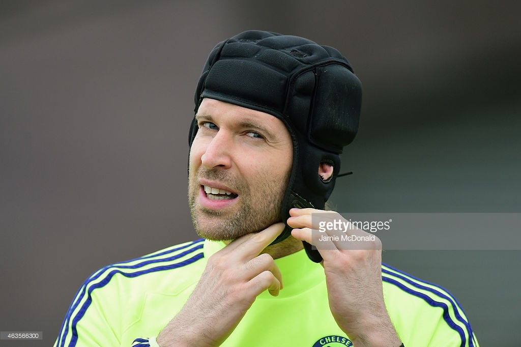 Keeper Petr Cech at Chelsea doing up his protective cap