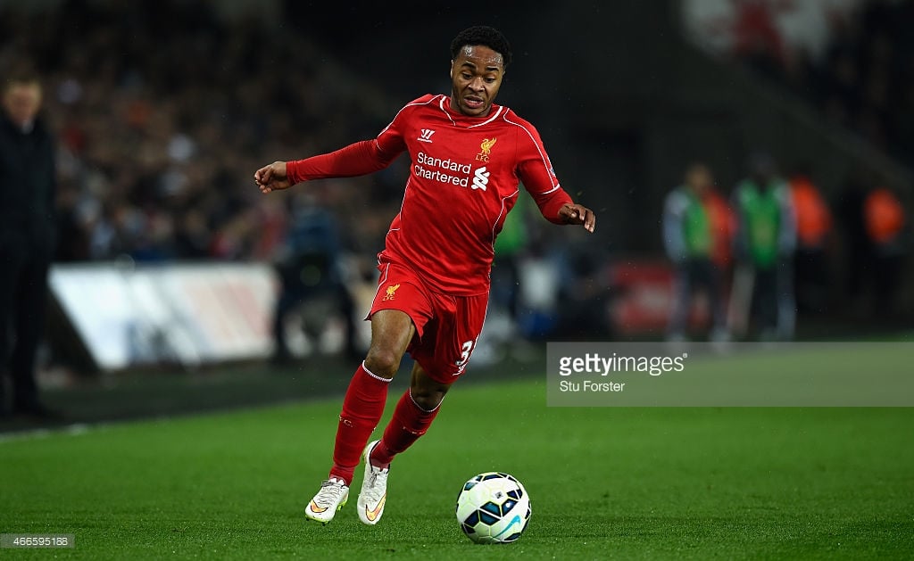 Liverpool winger Raheem Sterling runs with the ball whilst in action for his English Premier League side.