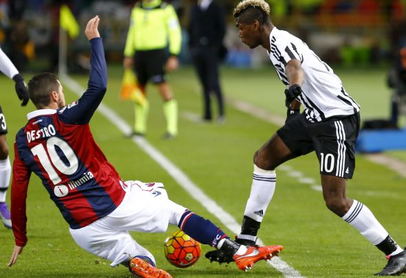 Mattia Destro makes a slide tackle for his Italian club Bologna