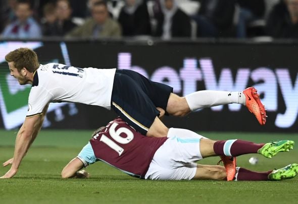 Mark Noble of West Ham tackles Eric Dier of Tottenham