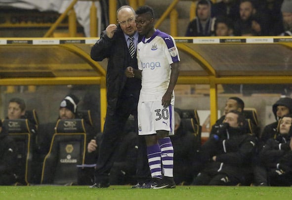 Christian Atsu receives his orders from Newcastle manager Rafa Benitez