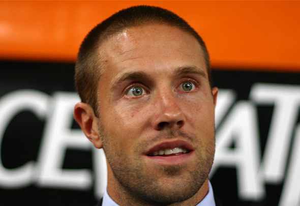 Matt Upson looks on