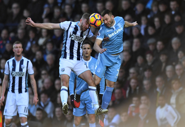 James Morrison of West Brom and Phil Bardsley of Stoke City contest an aerial battle