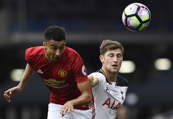 Ben Davies of Tottenham battles with Jesse Lingard of Manchester United