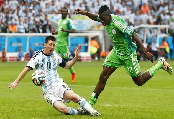 Kenneth Omeruo of Chelsea is tackled by Lionel Messi of Barcelona