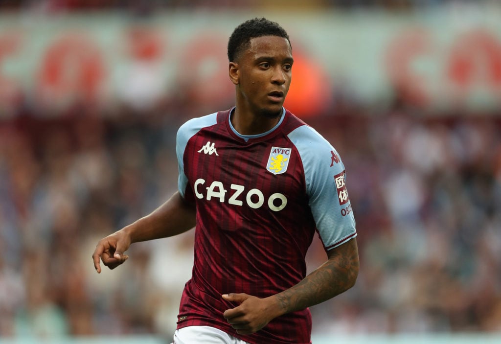 Aston Villa Ezri Konsa in claret and blue running