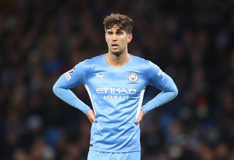 John Stones with his hands on his hips