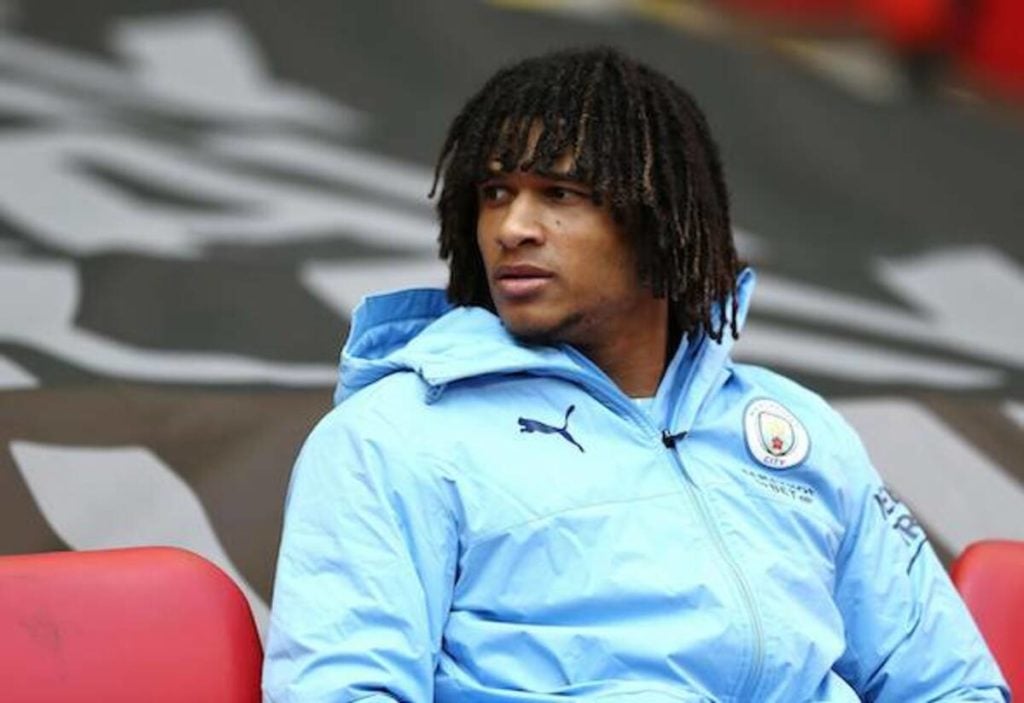 Nathan Ake on the Man City bench