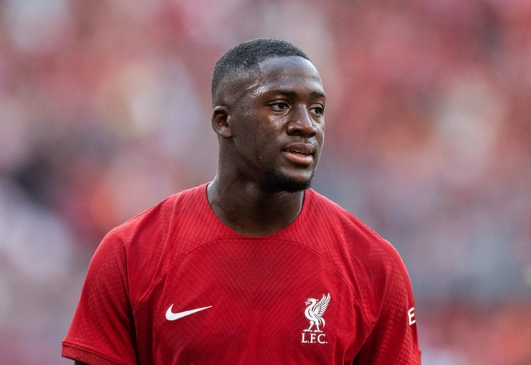Ibrahima Konate in red Liverpool shirt looking serious
