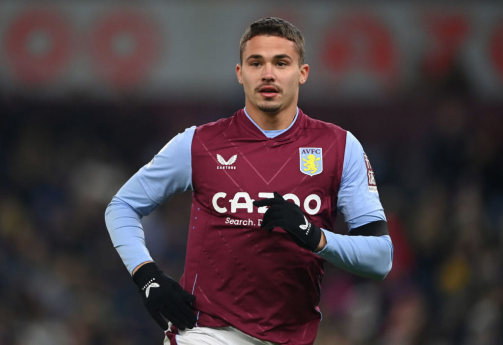 Aston Villa Leander Dendoncker running in claret and blue shirt