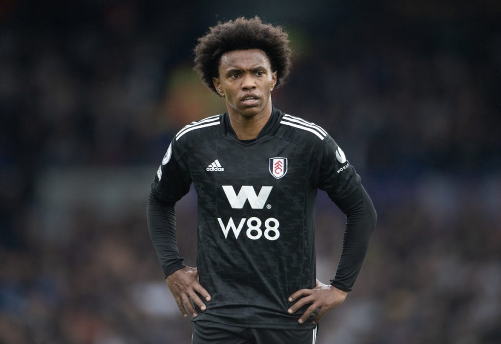 Fulham, Willian in black Fulham shirt with his hands on hips