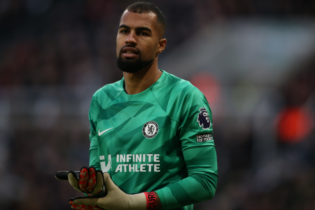 Robert Sanchez in Chelsea kit holding his gloves