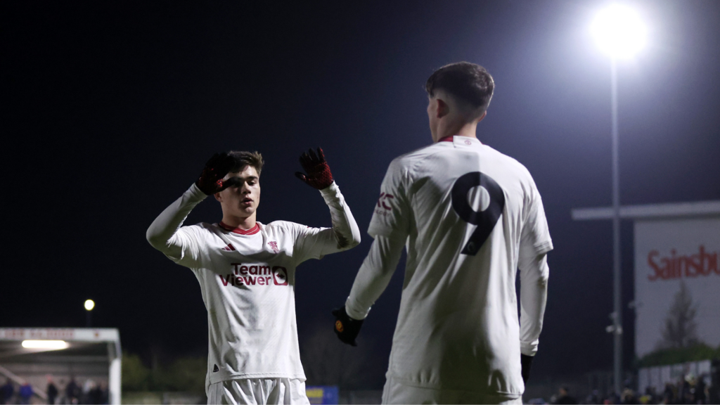 Harry Amass and Charlie McNeill in action in white shirts