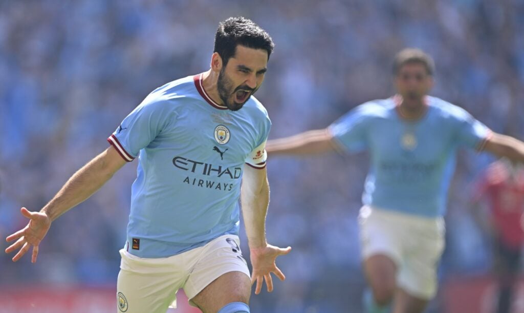 Man City Ilkay Gundogan celebrating with his arms wide open