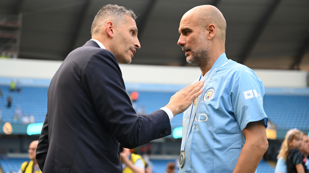 Man City chairman Khaldoon Al Mubarak speaking to Pep Guardiola