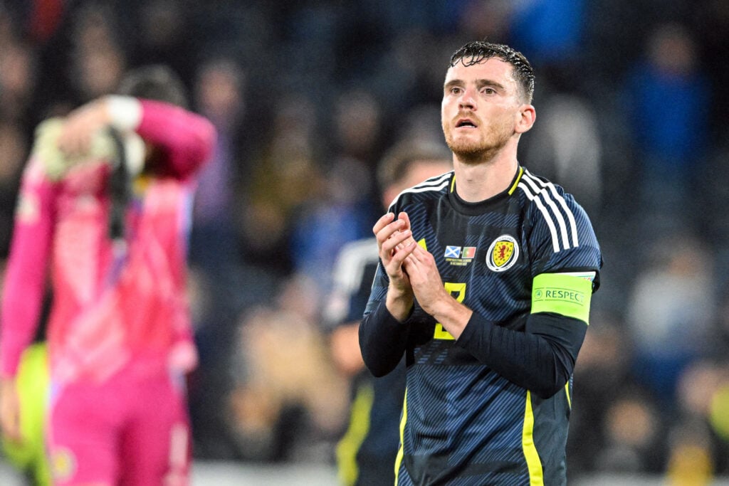 Andy Robertson applauding the fans post-game for Scotland