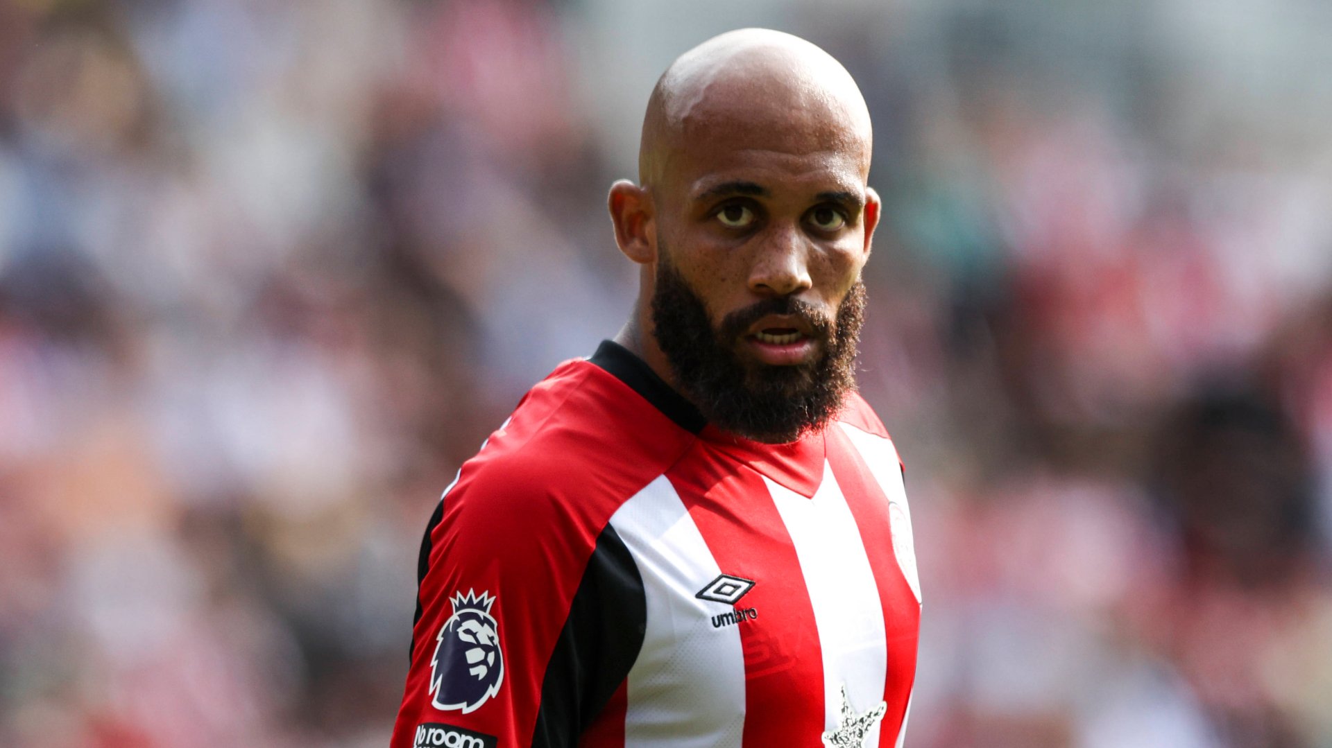 Bryan Mbeumo looks on in Brentford kit.