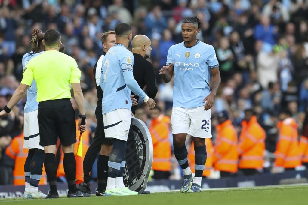 Manuel Akanji being substituted on for Man City