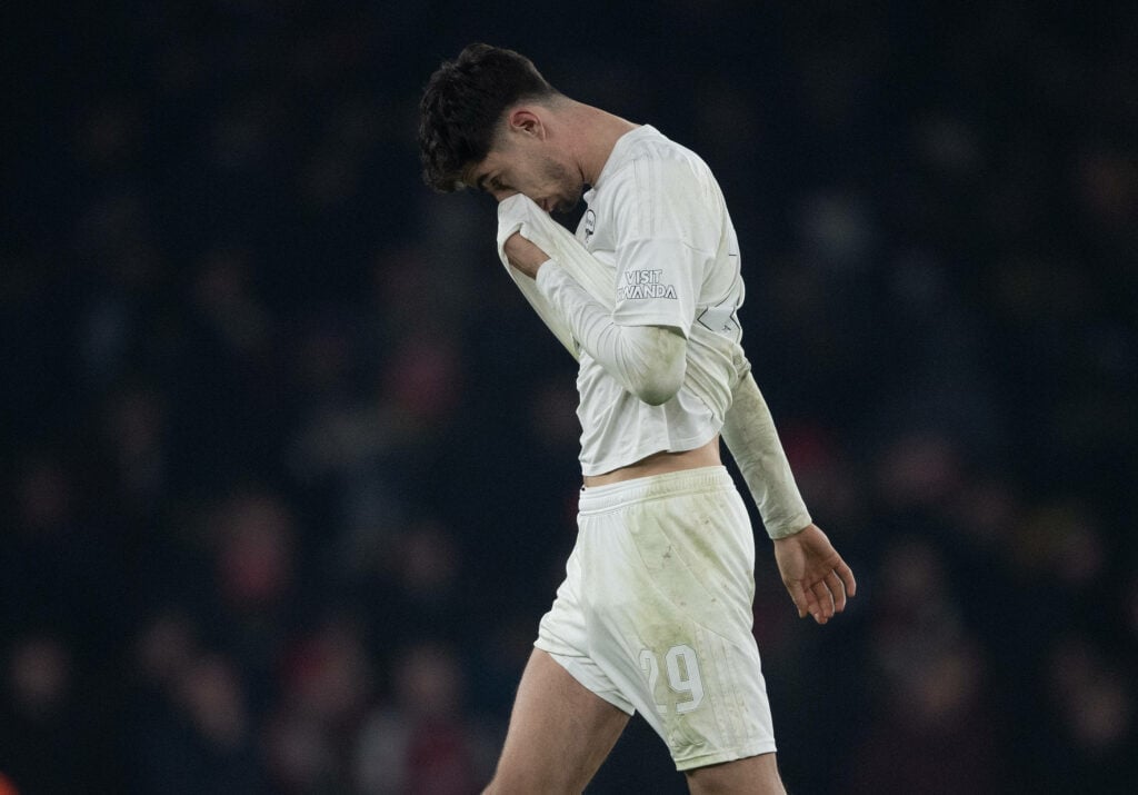 Kai Havertz walks off the pitch as he wipes his head with his shirt
