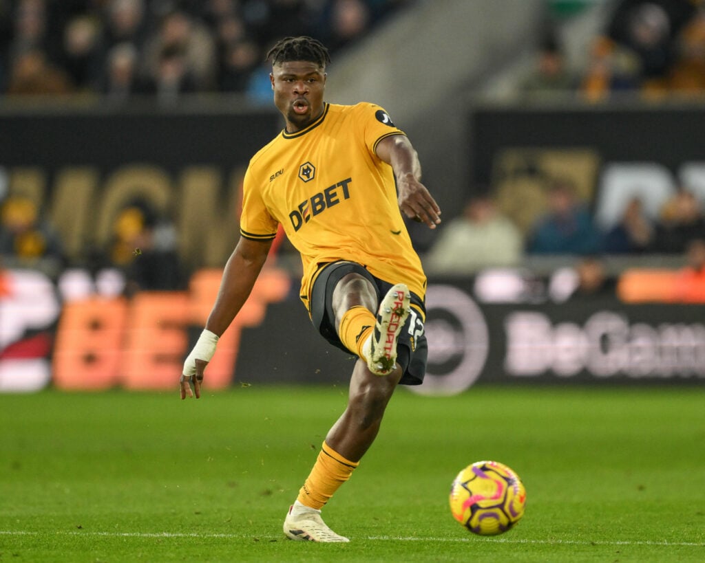 Emmanuel Agbadou playing a pass for Wolves.
