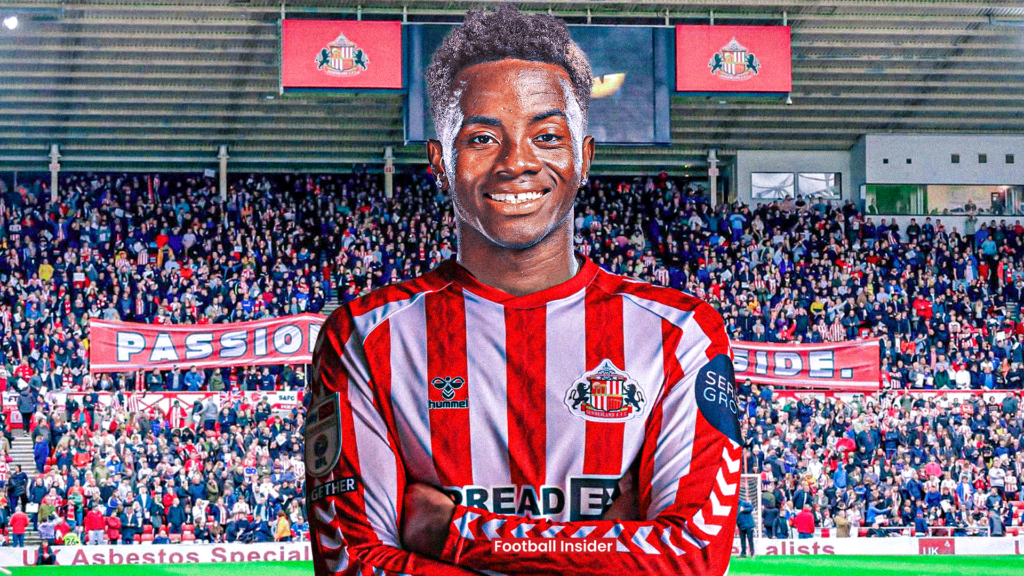 Simon Adingra poses in a Sunderland shirt