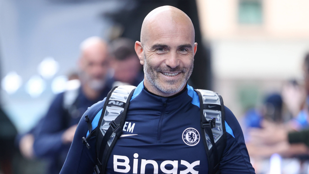 Enzo Maresca smiles as he arrives at Stamford Bridge in a Chelsea jacket