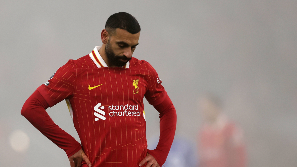 Liverpool forward Mo Salah looking down to the ground