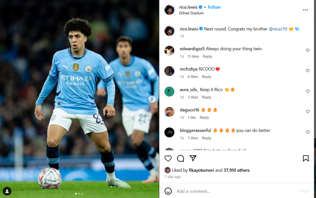 Rico Lewis celebrates Man City win