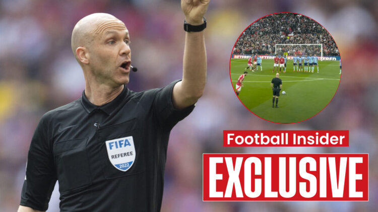 Referee Anthony Taylor watches Bruno Fernandes score a freekick