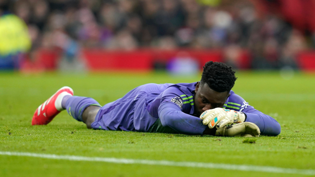 Andre Onana Man United lying on the floor with his head in hands