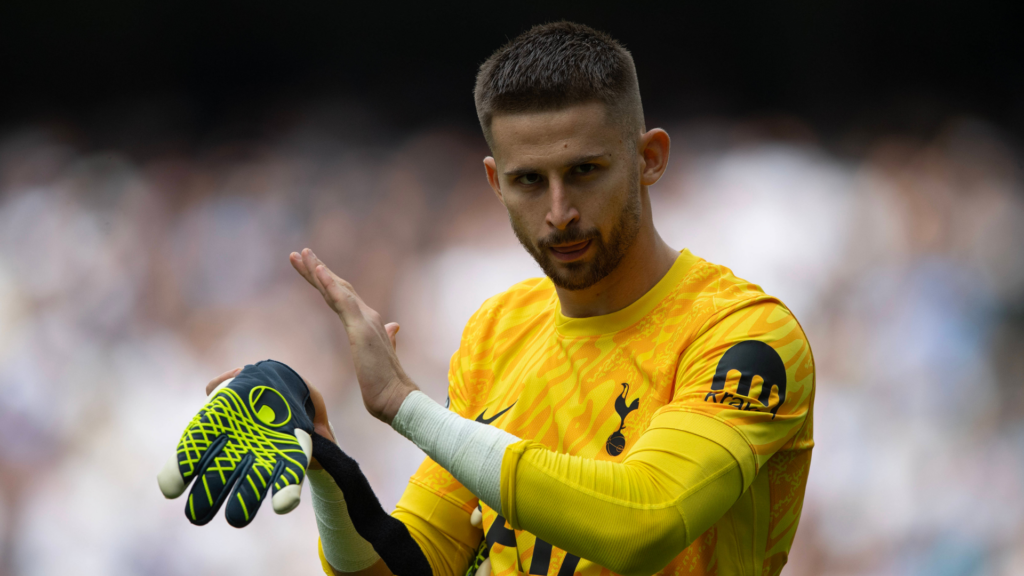 Guglielmo Vicario Tottenham in yellow jersey clapping hands