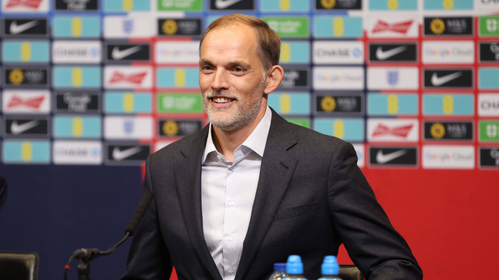 Thomas Tuchel, England smiling in a suit