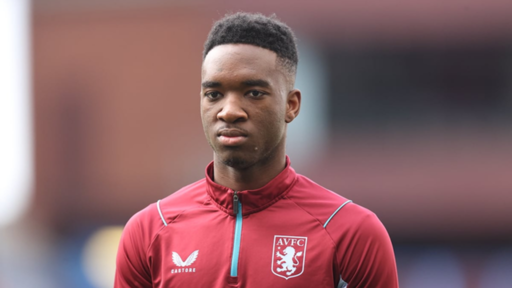 Lamare Bogarde stands before a game for Aston Villa.