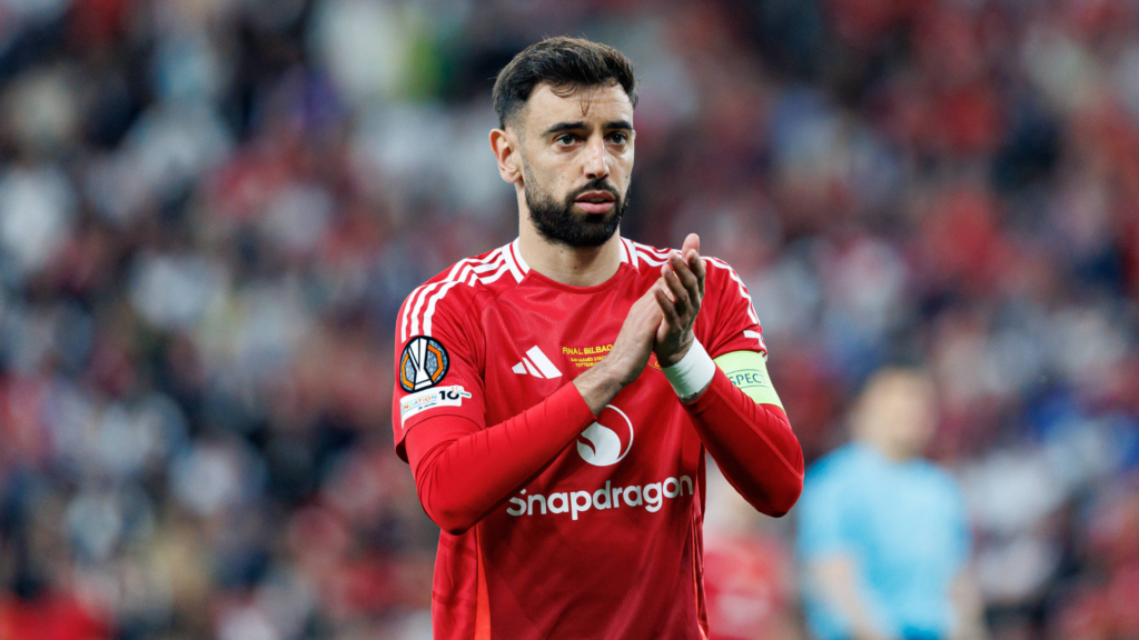 Bruno Fernandes clapping the Man United supporters.