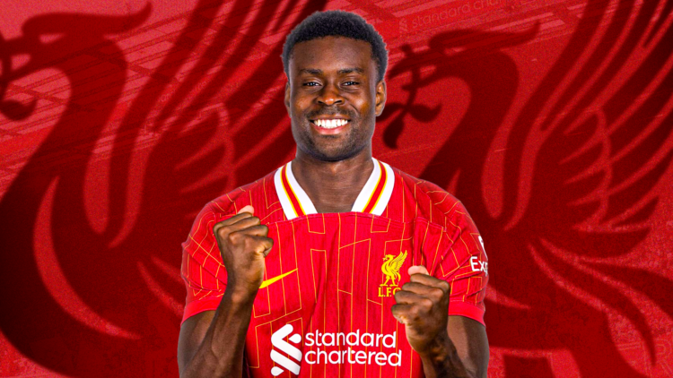 Marc Guehi looking delighted in a Liverpool shirt.