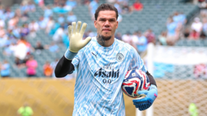 Ederson waving at Man City