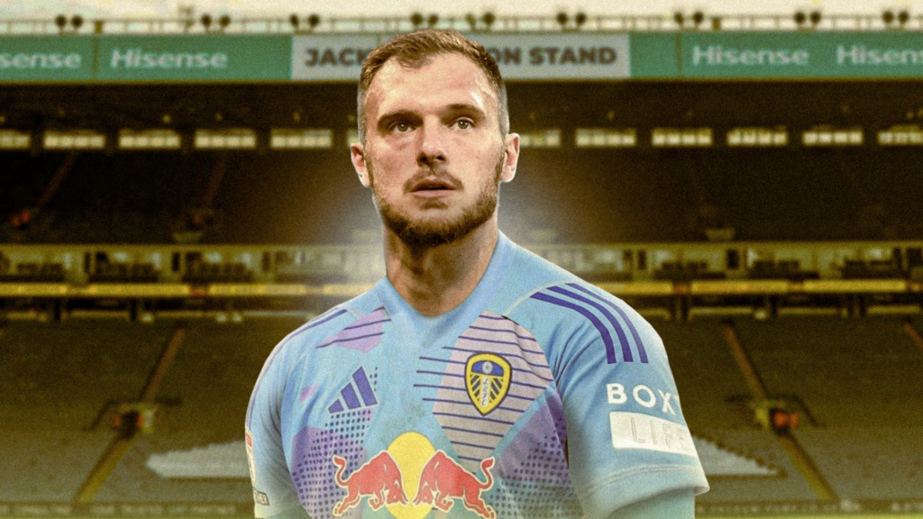 Lucas Perri Leeds United in front of Elland Road in a blue shirt looking strong