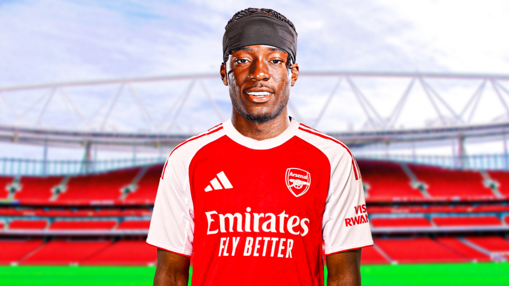Noni Madueke, in Arsenal colours with a back drop of Emirates Stadium.