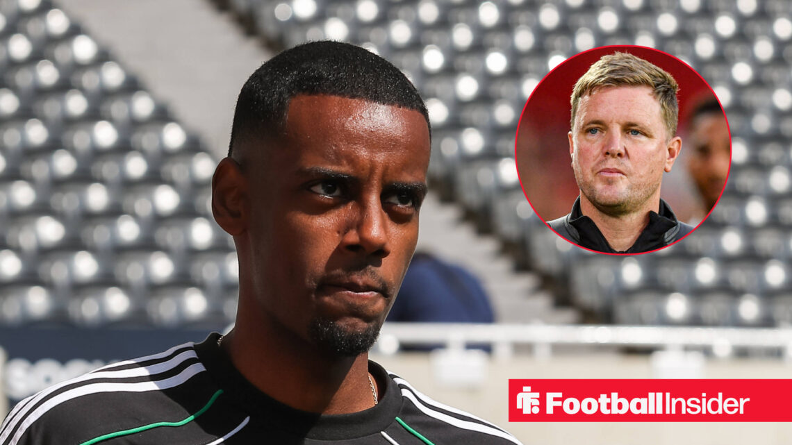 Alexander Isak in a black tracksuit top staring with intent at Eddie Howe
