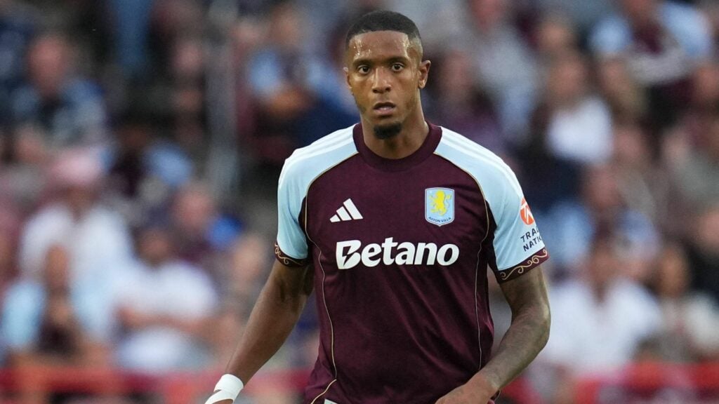 Ezri Konsa in action for Aston Villa with a claret and blue shirt
