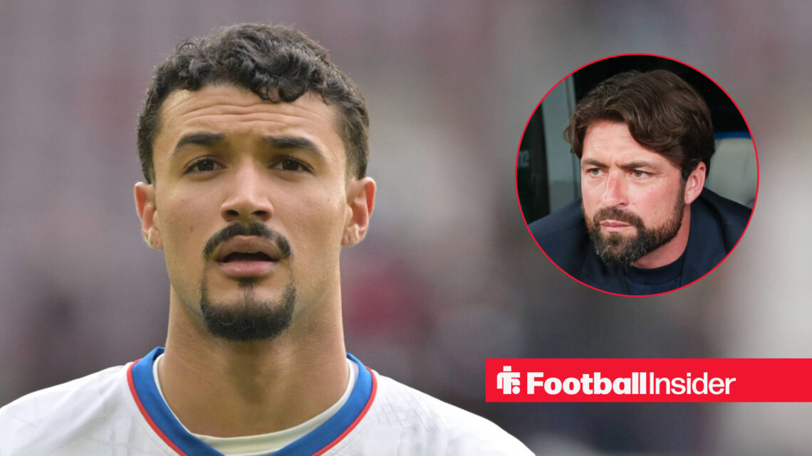 Rangers defender Jefte looks on, next to an image of manager Russell Martin.