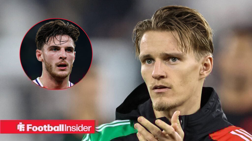 Arsenal's Martin Odegaard clapping before a game facing teammate Declan Rice in action