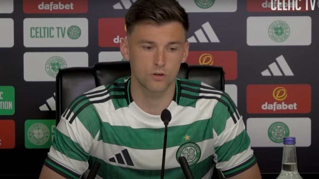 Celtic star Kieran Tierney sat behind a microphone