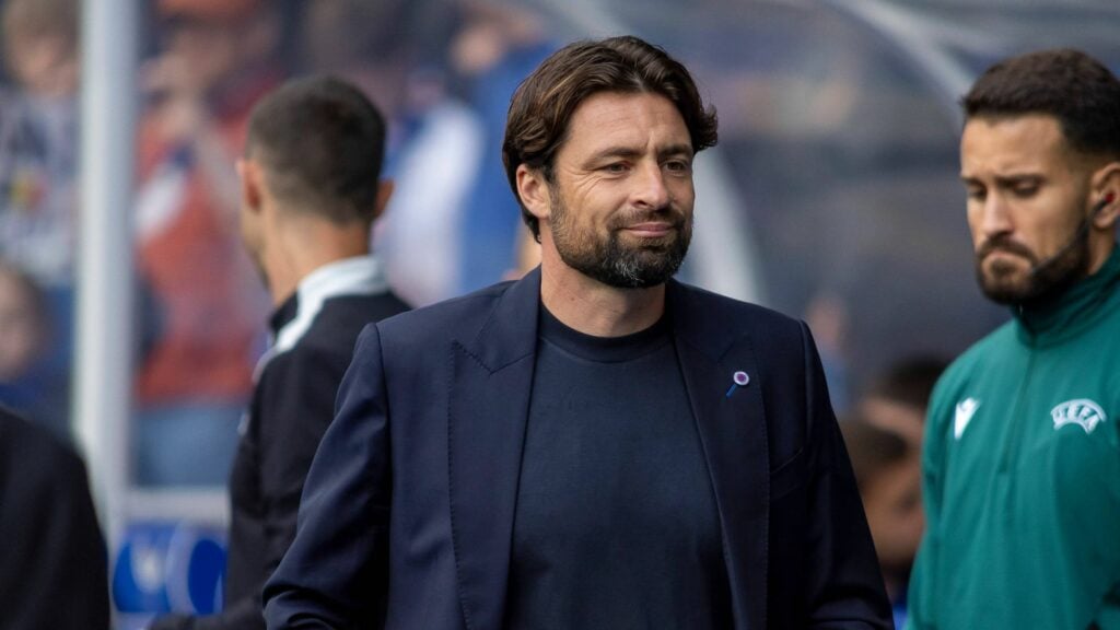 Russell Martin smiling on the Ibrox touchline