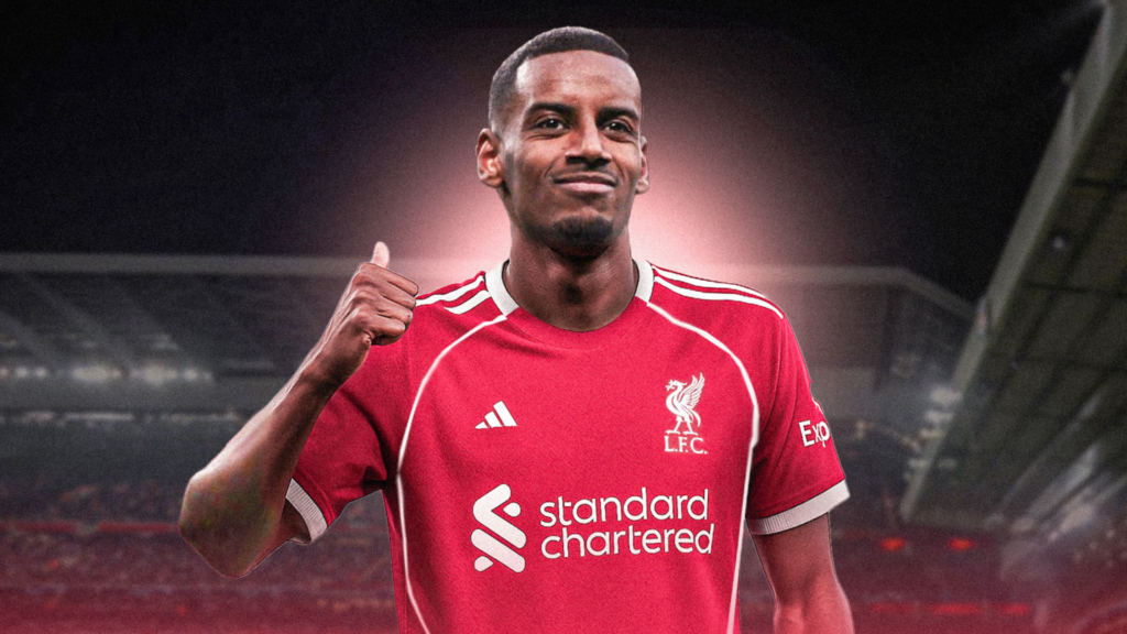 Alexander Isak wearing a Liverpool kit doing his trademark pointing backwards celebration
