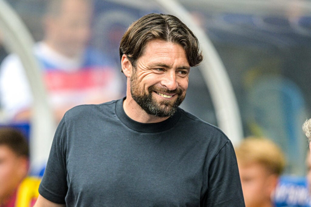 Russell Martin smiling on the Ibrox touchline